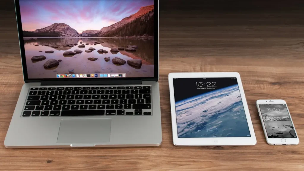 Laptop, tablet, and smartphone on desk