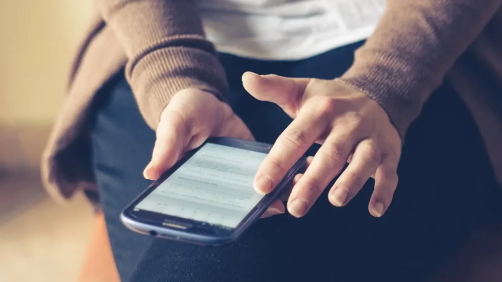 Person reading online contract on smartphone