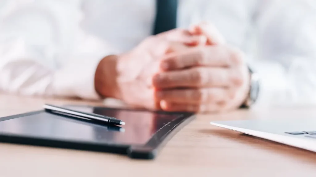 Businessman using esignature with stylus and pad