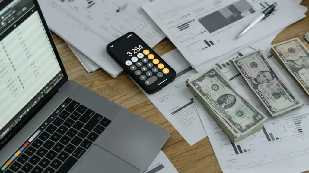 Financial planning wit calculator and laptop