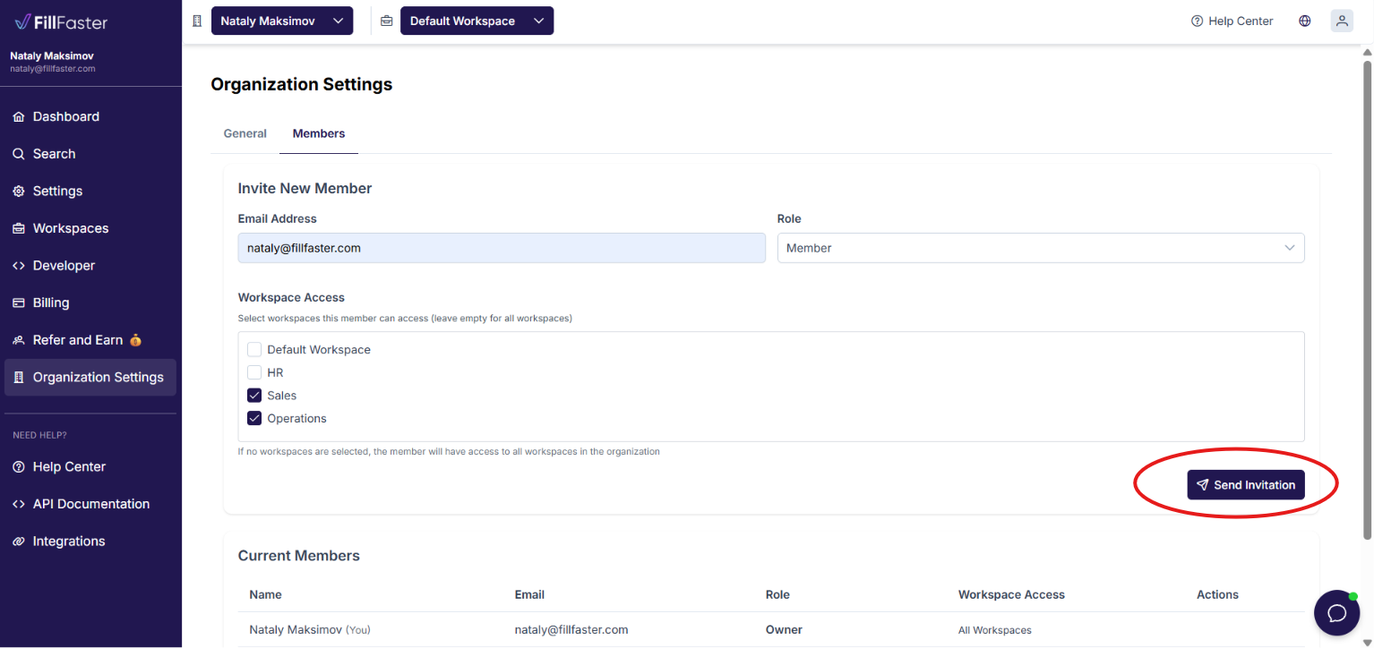 Organization settings showing an invitation and the workspaces assigned to that member.